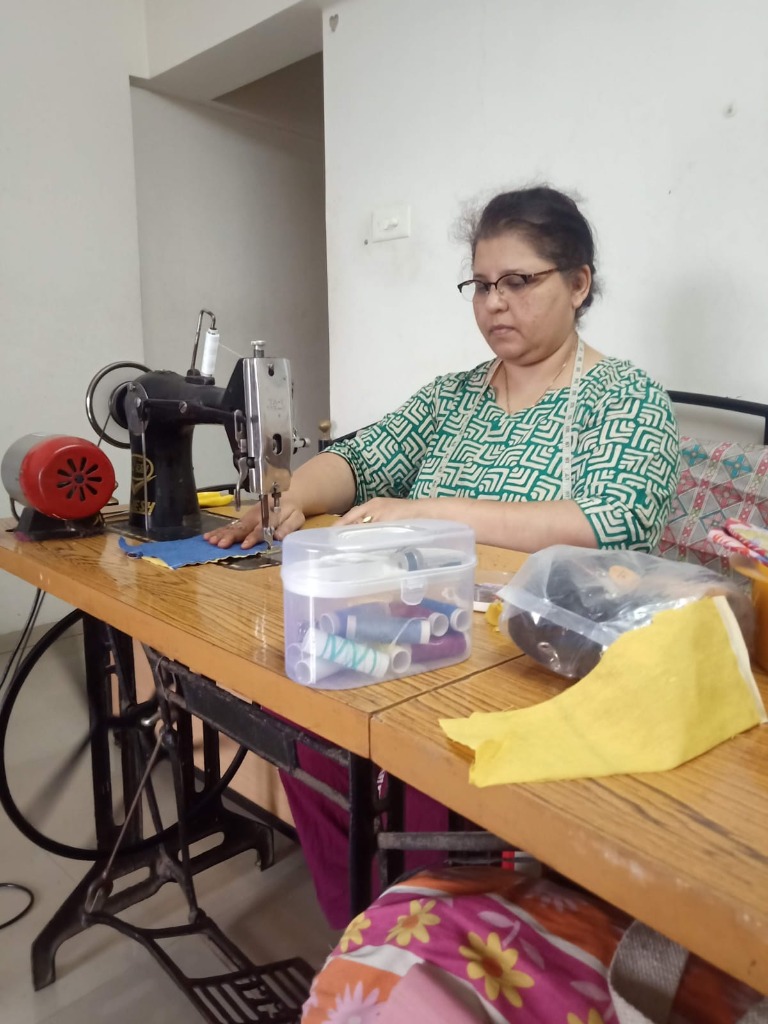 Student practicing machine stitching and seam alignment